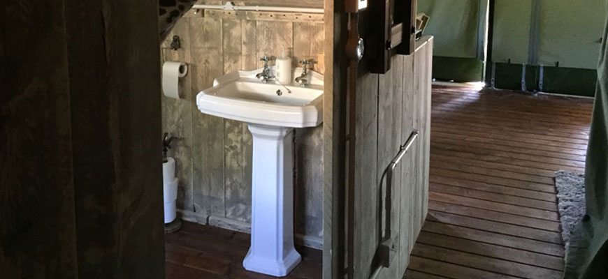 woody safari tent bathroom